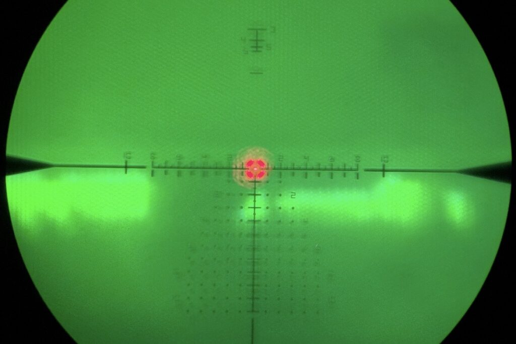 Phone photo through LPVO with DNT Hydra HS335R clip-on thermal at 10x viewing cattle at 290 yards
