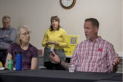 Nebraska U.S. Senate candidate Dan Osborn speaks during a town hall discussion, explaining a proposal that would require owners of certain semi-automatic rifles to undergo periodic mental health evaluations and firearm re-registration.