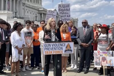 An anti-gun democrat stands at the podium.