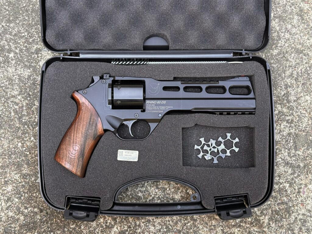 Chiappa Rhino 60 DS 10mm revolver in a foam-lined hard case with moon clips, trigger lock, brush, and paperwork