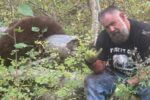 Joelseph Jenkins poses beside an unlawfully harvested black bear during an illegal guiding operation that led to prison time and a lifetime hunting ban in Idaho.