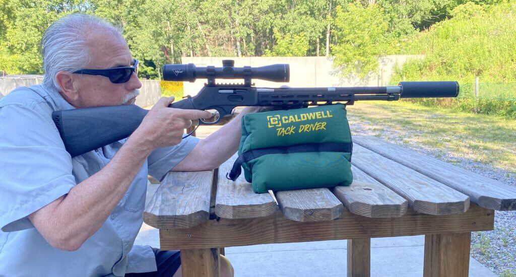 Low-mounted Trijicon Huron scope on the Henry SPD HUSH showing no cheek riser was needed
