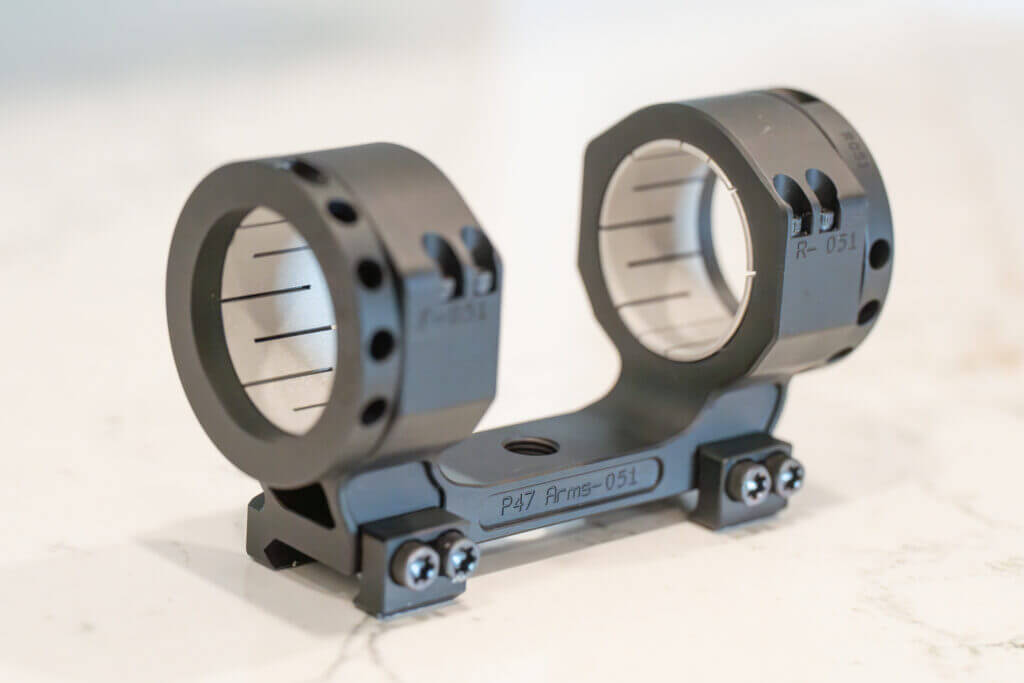 Numbered Project 47 Force 360 scope mount components arranged for installation and reassembly