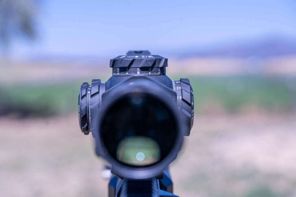 Close-up of precise tactile turret adjustments on the ZCO ZC210 2-10x30 riflescope