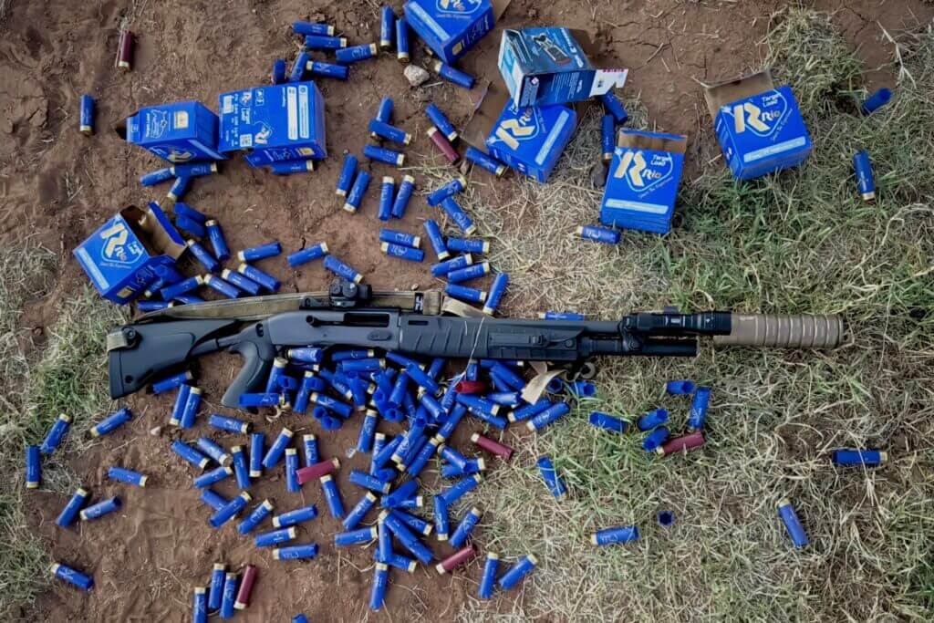 Rapid-fire Benelli M2-G1 reliability testing with multiple boxes of 12-gauge ammunition