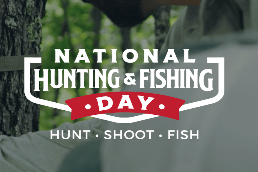 National Hunting and Fishing Day logo over a hunter in camouflage sitting in a tree stand.
