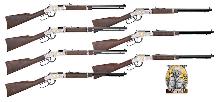 Seven Henry Golden Boy Silver tribute rifles with walnut stocks and engraved silver-colored receivers, arranged on a white background.