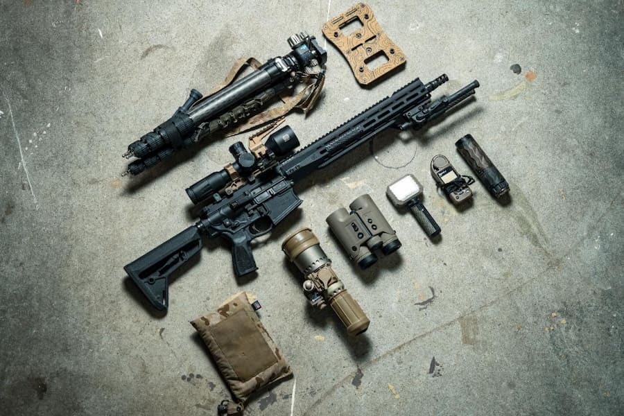 PWS piston-driven rifle displayed with optics, suppressors and tactical accessories on a concrete floor.