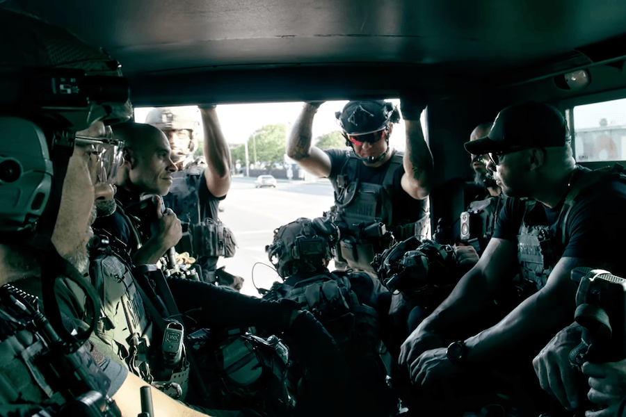 Miami-Dade Sheriff’s Office Special Response Team members prepare inside a tactical vehicle.
