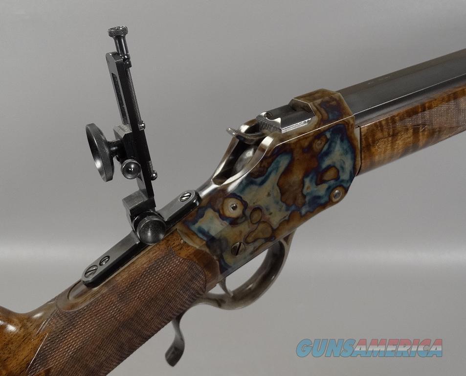 This ad features the pictured Winchester Model 1885 High Wall Rifle in 45-7...